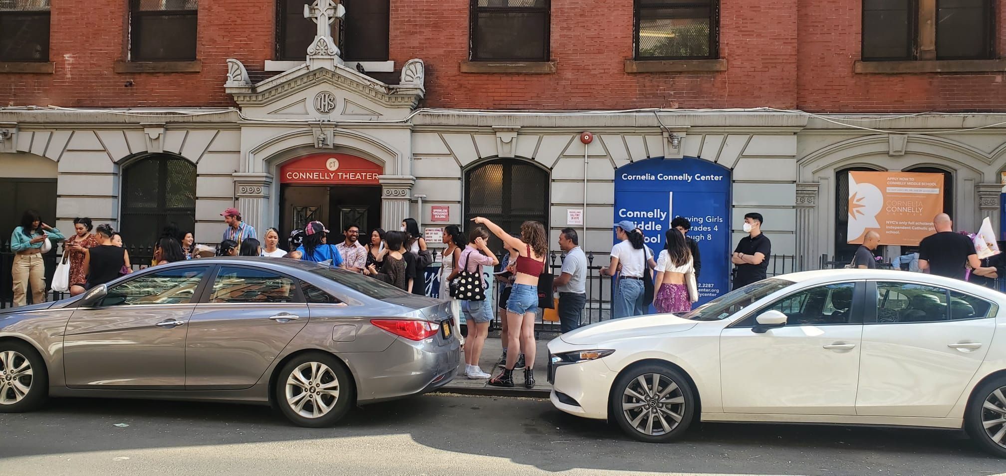 SheNYC audience members wait outside the Connelly Theater before a performance. Photo credit: John Crain.