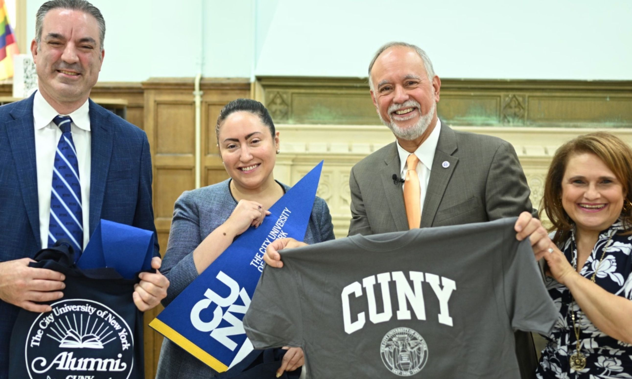 CUNY Chancellor Matos Rodríguez distributes CUNY alumni merchandise to Schools Chancellor Aviles-Ramos, second from left, who spoke to students about her experiences as a CUNY alumna. - 1