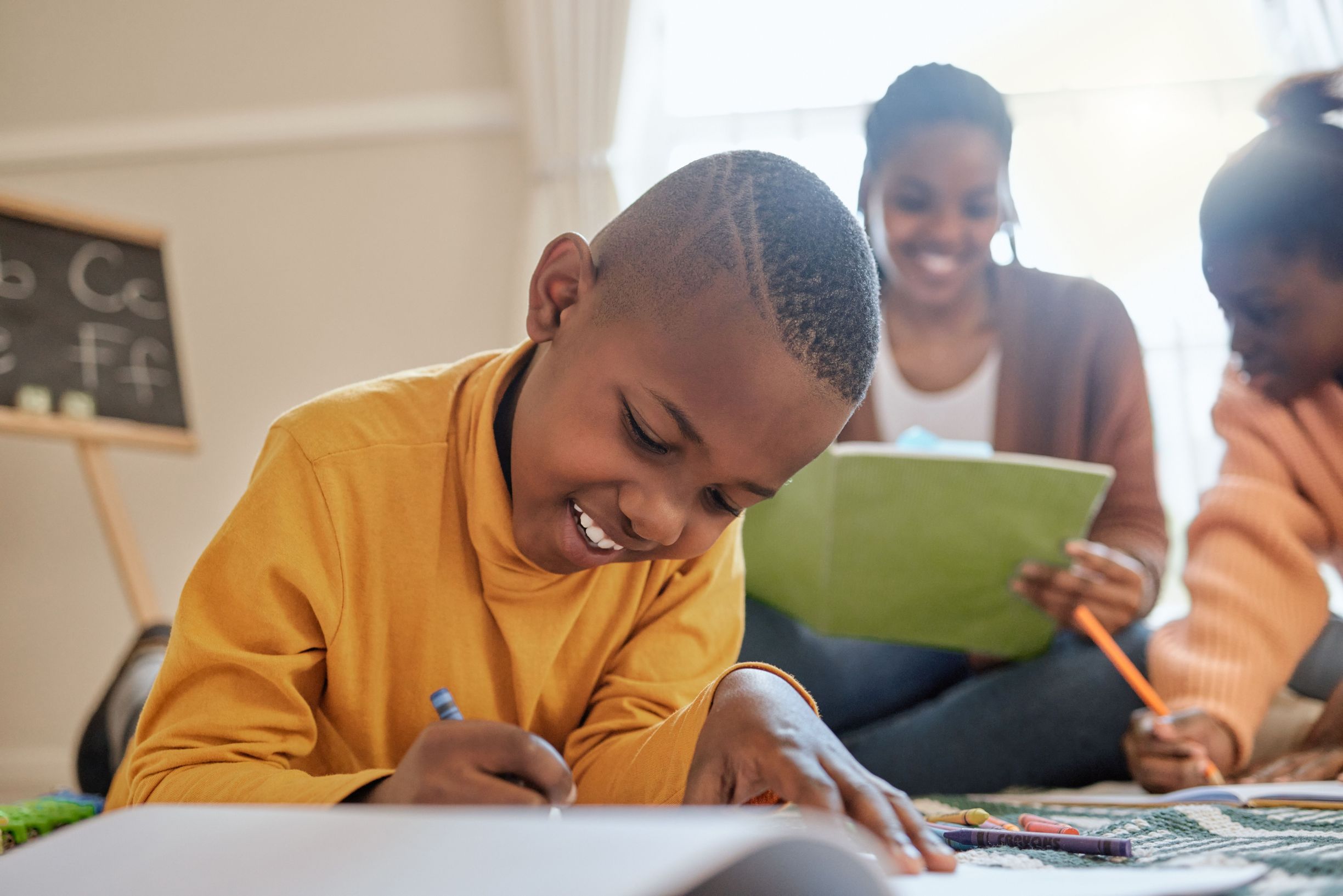 Boy,,Black,Child,And,Writing,In,Living,Room,For,Homework,