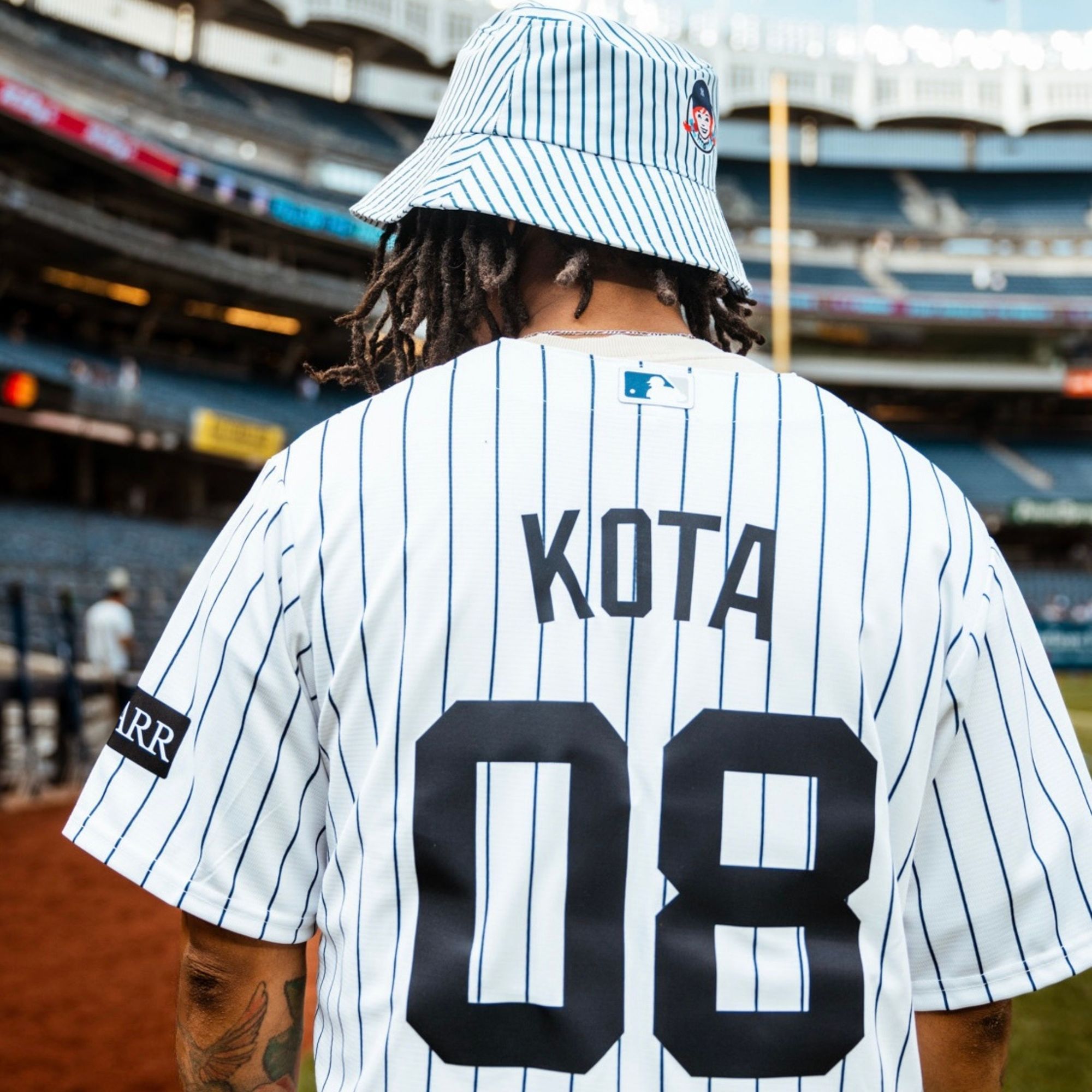 Kota the Friend at Yankee Stadium Name on Yankee Jersey - 1