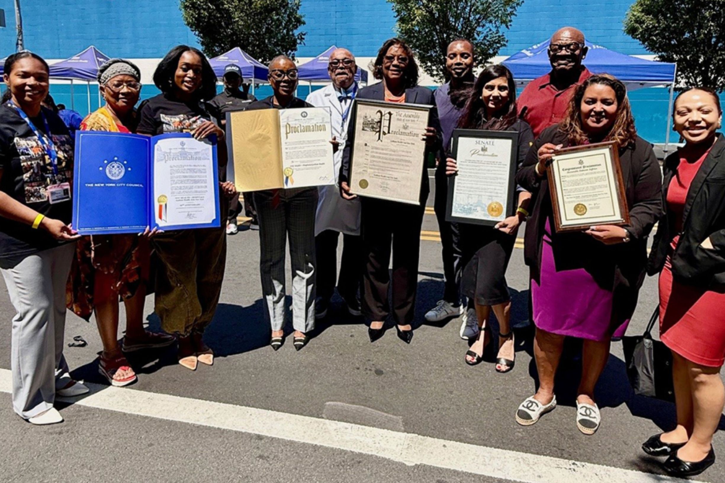 Council Member Chris Banks and representatives from the offices of local elected officials present Gotham Health, East New York