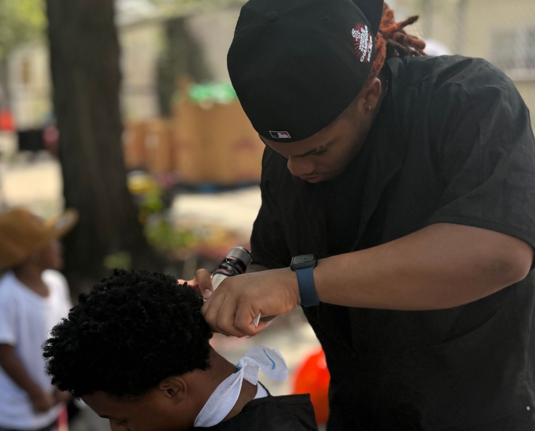 Student getting haircut at ENY Back to School Giveaway
