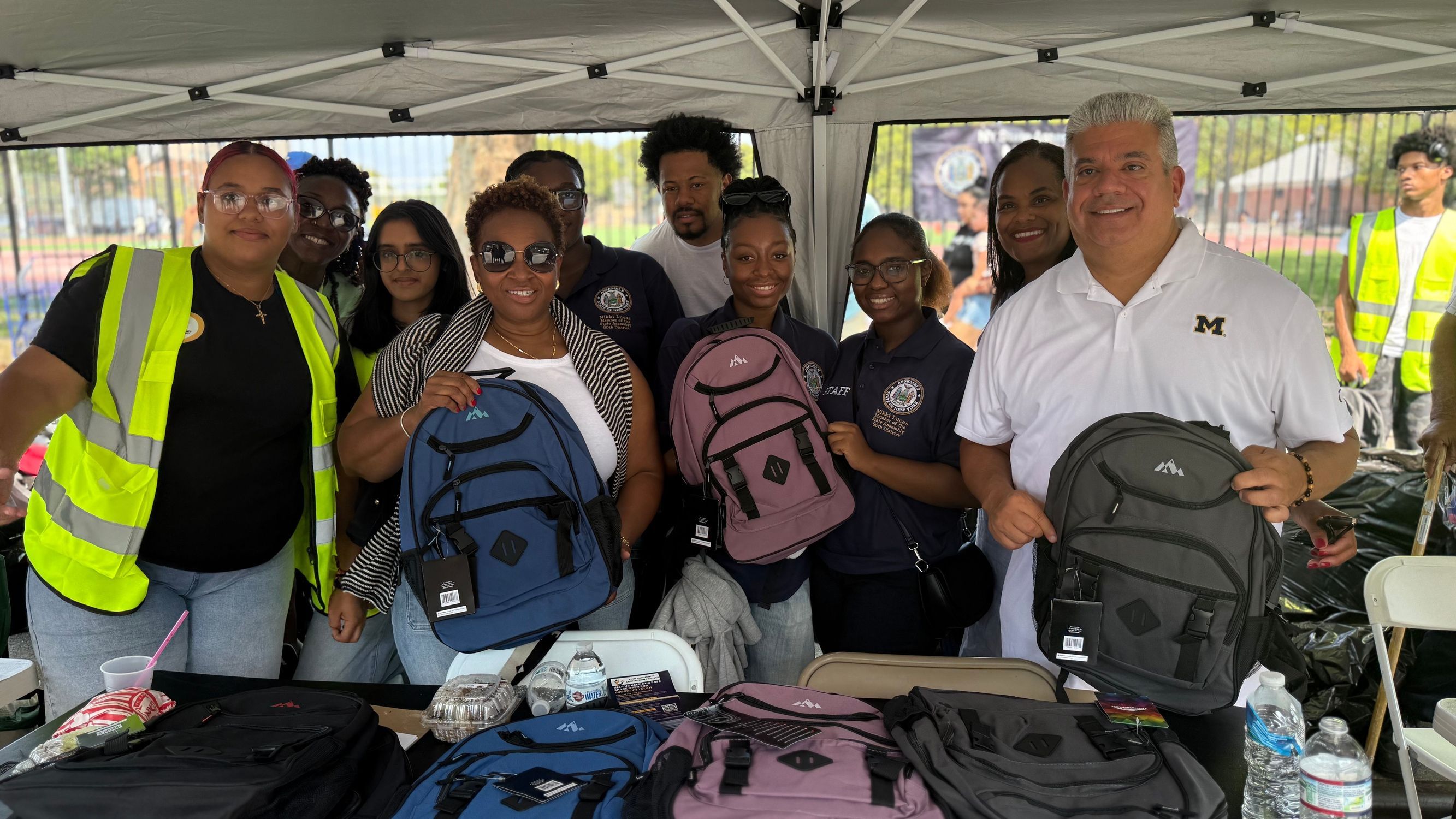ENY Back to School Giveaway Group pic Assemblywoman Nikki Lucas, DA Eric Gonzalez, District Leader Mike Rosendary and others.jpeg