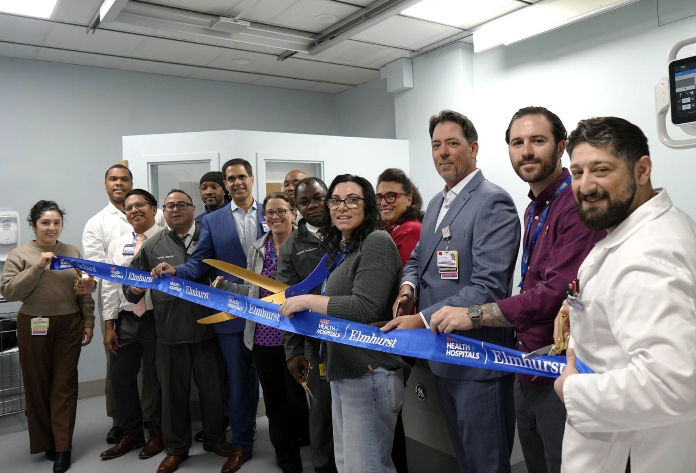 NYC Health + Hospitals Leadership and Radiology Department gather to cut ribbon in newly renovated room inside the hospital’s radiology suite. - 1